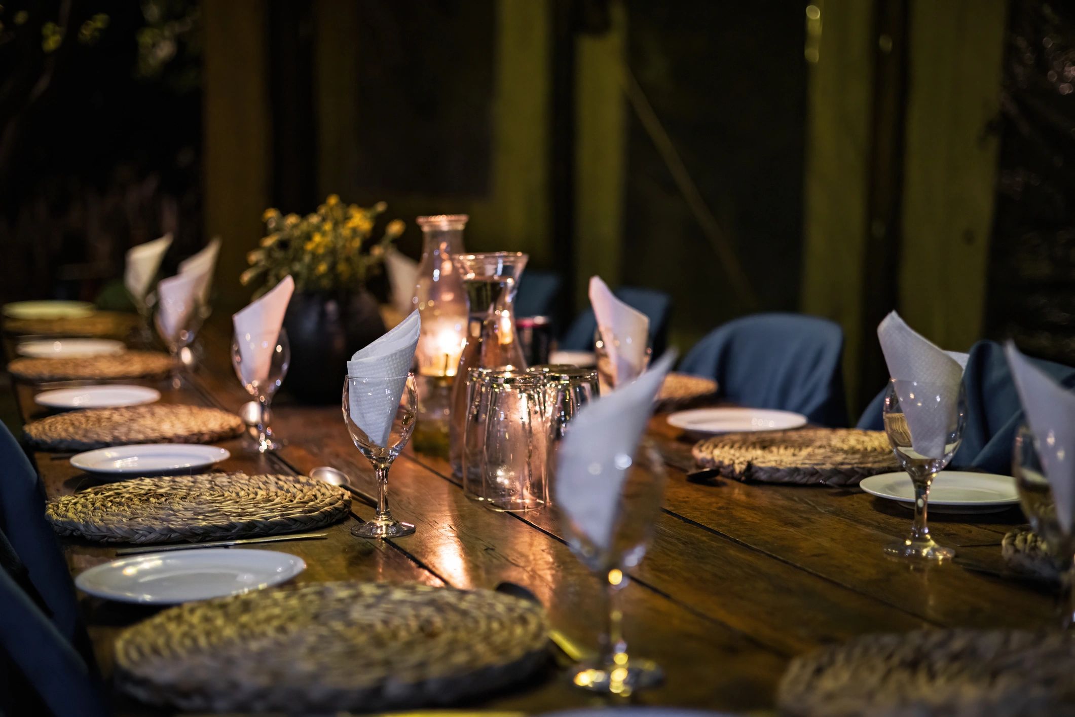 Candlelit dining table set for an event