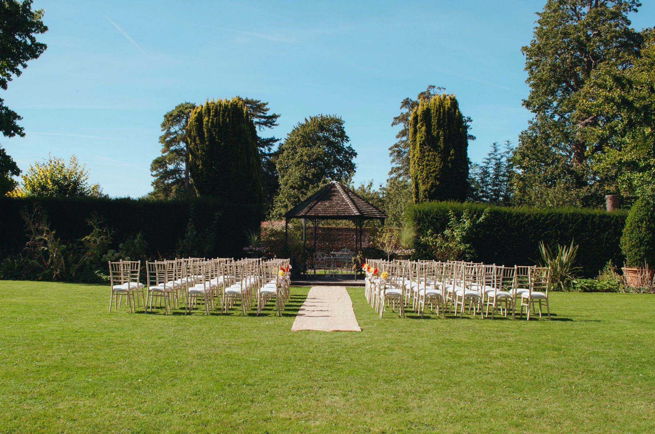 Outdoor ceremony seating and floral decor